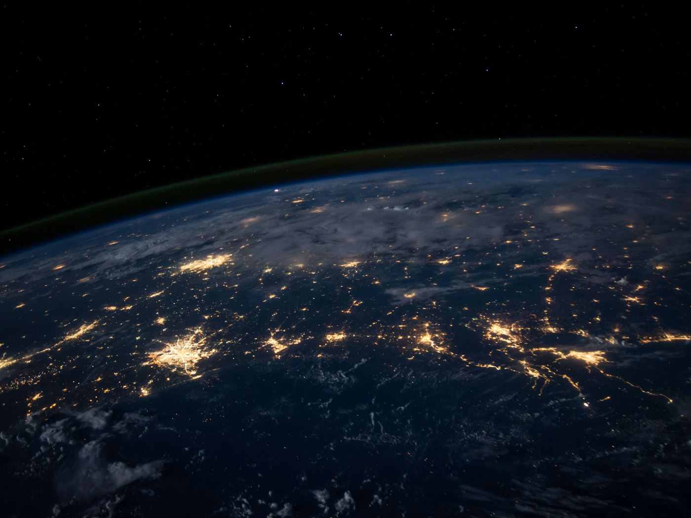 The curve of Earth with illuminated cities seen from space
