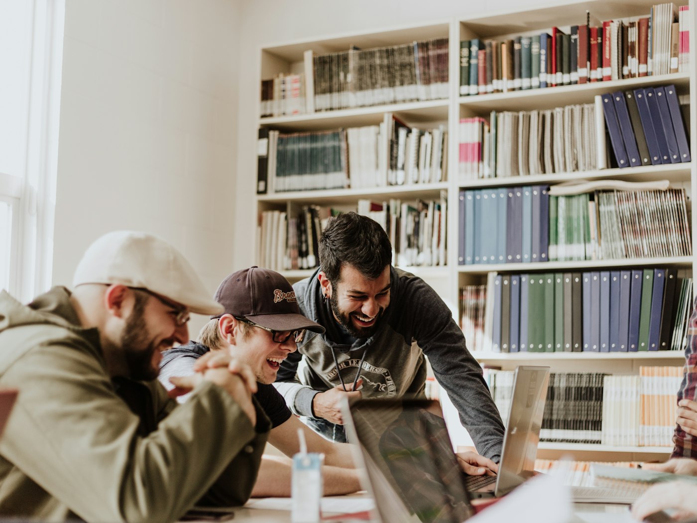 Students sharing ideas in a library